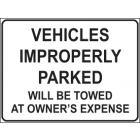 Vehicles Improperly Parked Will Be Towed At Owners Expense Sign